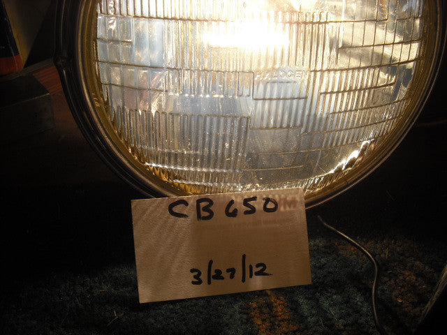 SoldHonda 1980 CB650 33100-425-671 Working Headlight and Chrome Ring