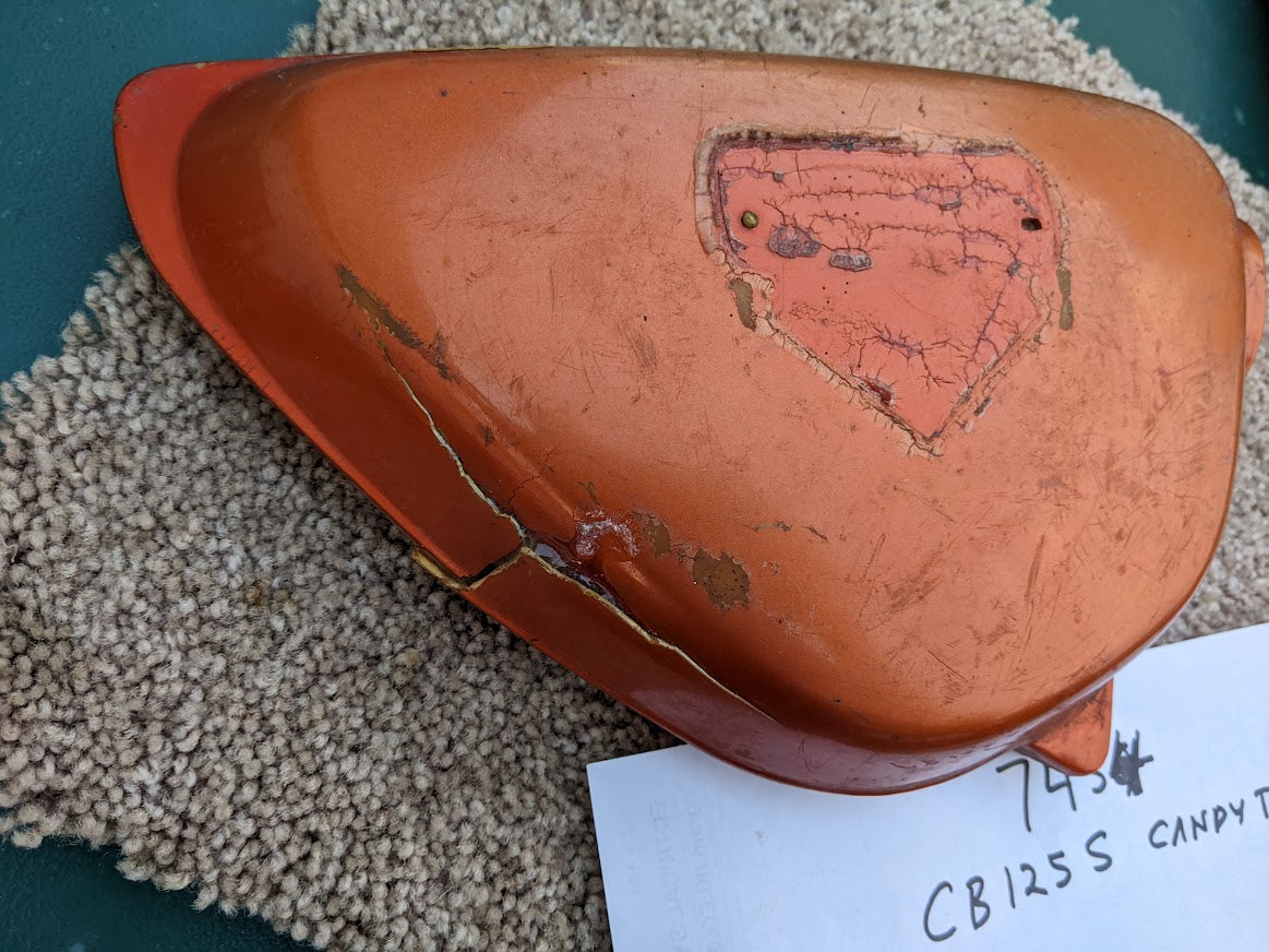 Honda CB125 OEM right sidecover with damage sku 7454