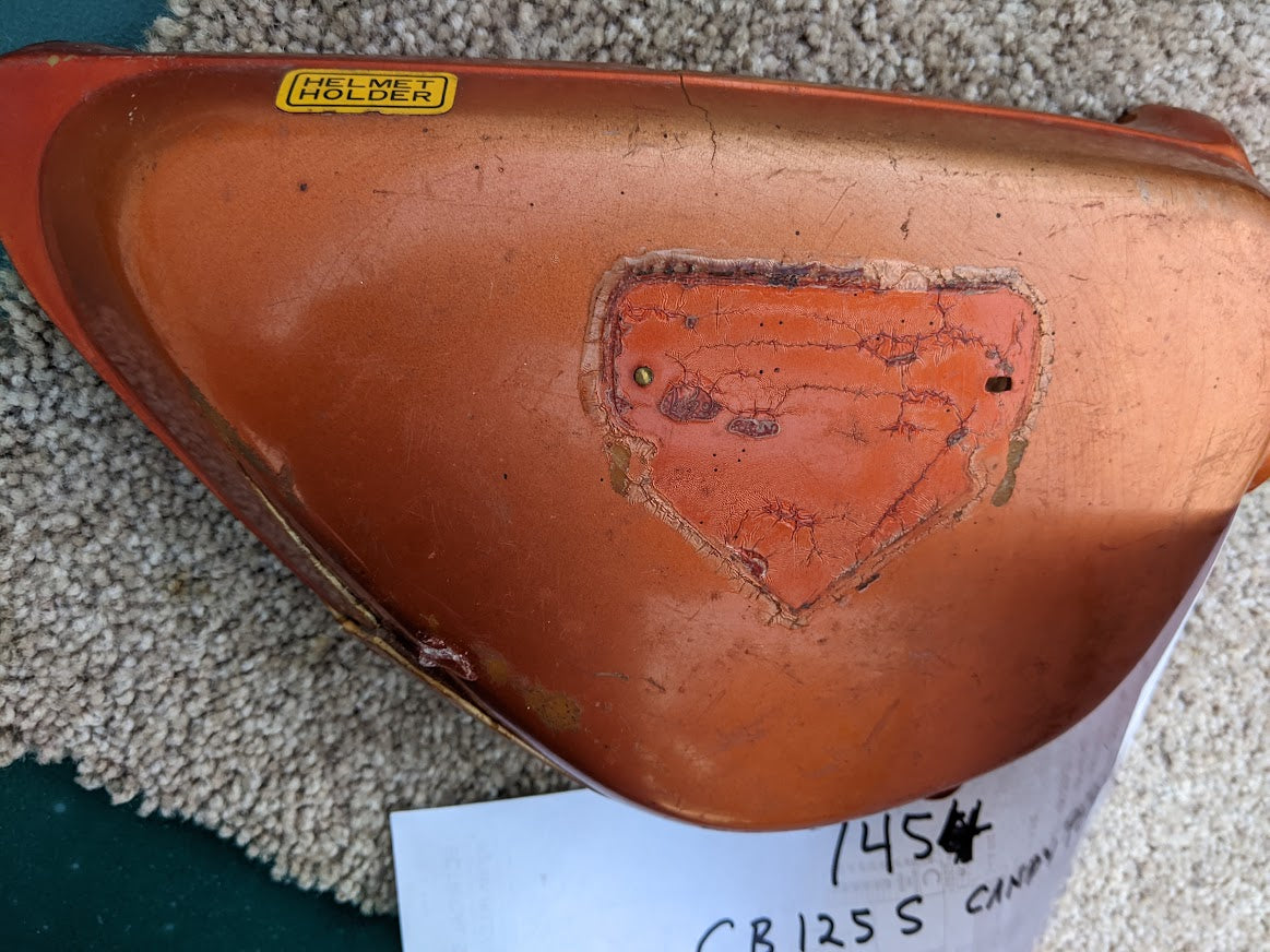 Honda CB125 OEM right sidecover with damage sku 7454