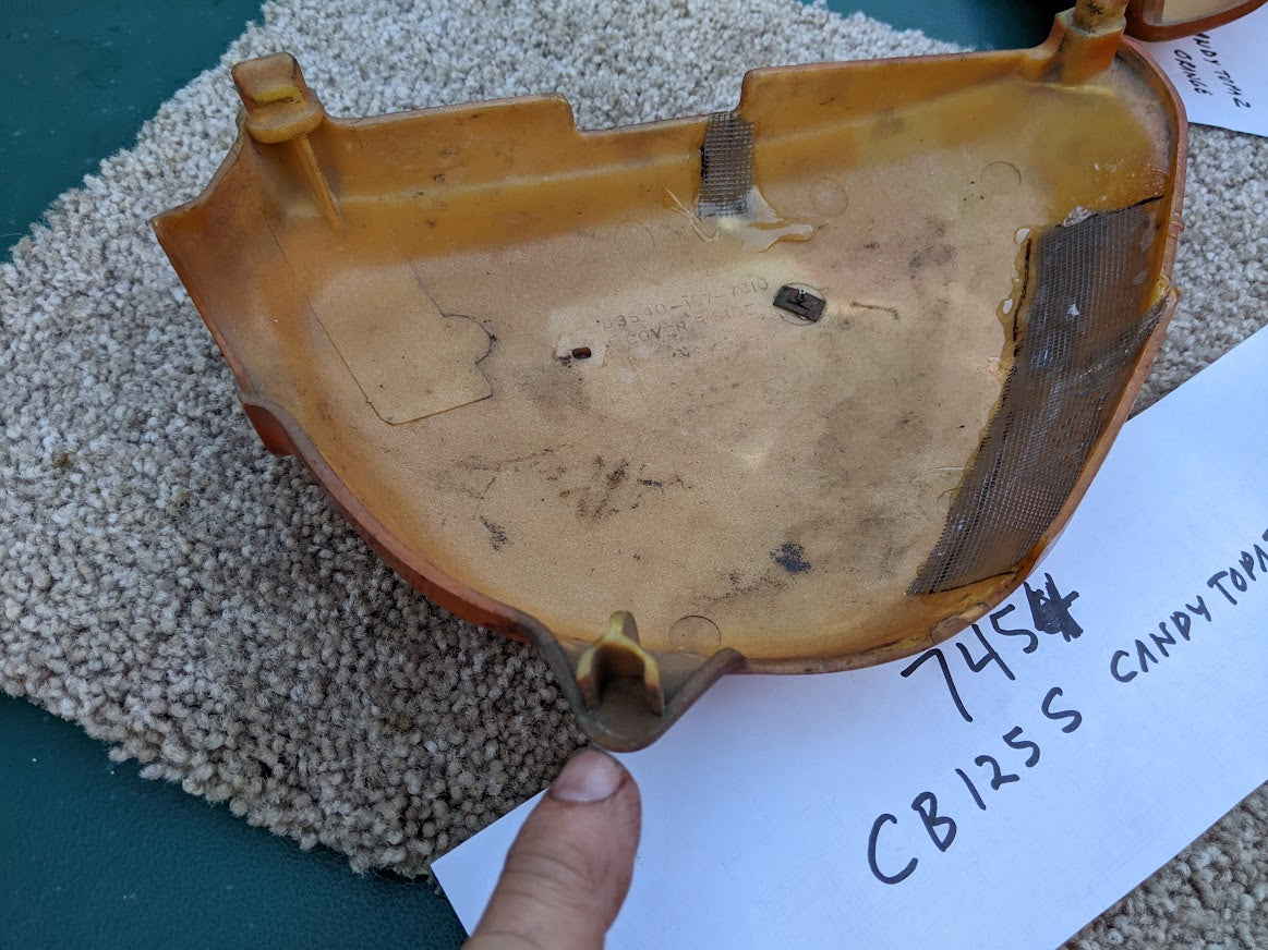 Honda CB125 OEM right sidecover with damage sku 7454