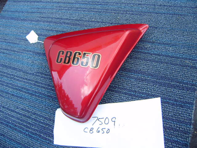 Honda CB650 candy Bourgogne red rt NOS  sidecover Honda part 83810-460 my sku 7509