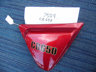 Honda CB650 candy Bourgogne red rt NOS  sidecover Honda part 83810-460 my sku 7509