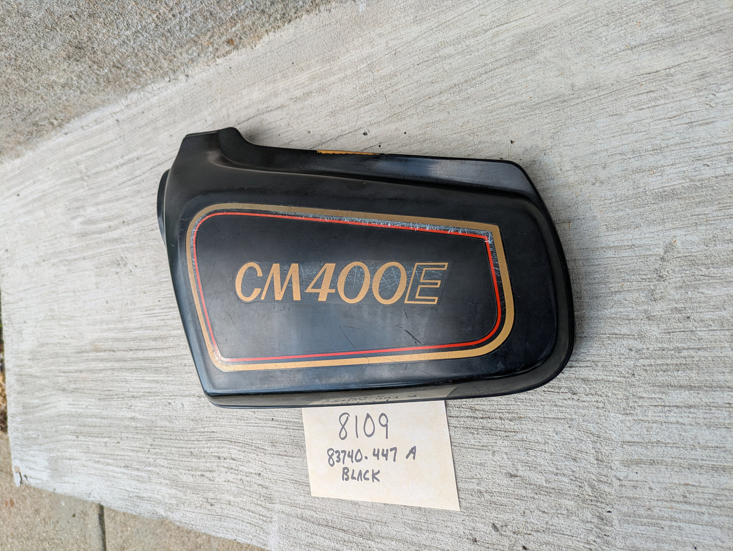 Honda CM400E black  Left Side Cover  83740-447A Missing a mounting pin sku 8109
