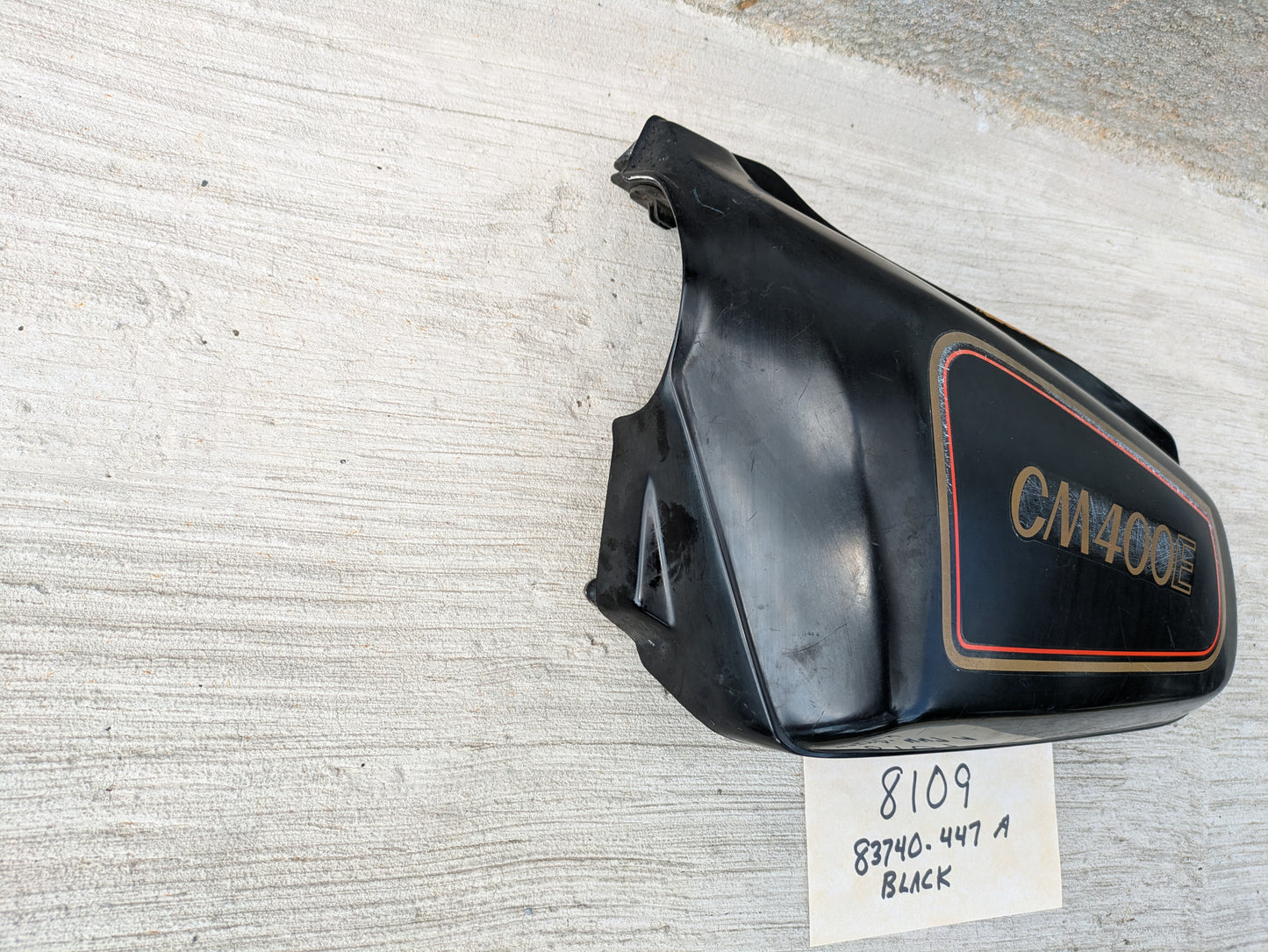 Honda CM400E black  Left Side Cover  83740-447A Missing a mounting pin sku 8109