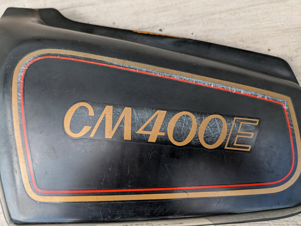 Honda CM400E black  Left Side Cover  83740-447A Missing a mounting pin sku 8109