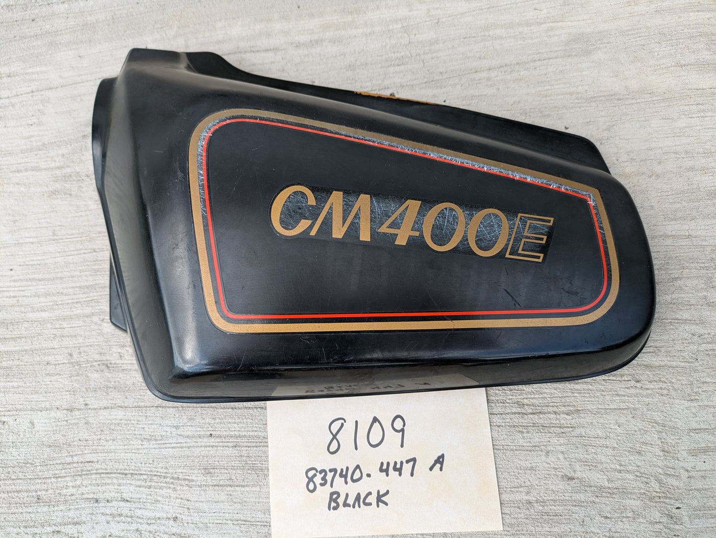 Honda CM400E black  Left Side Cover  83740-447A Missing a mounting pin sku 8109