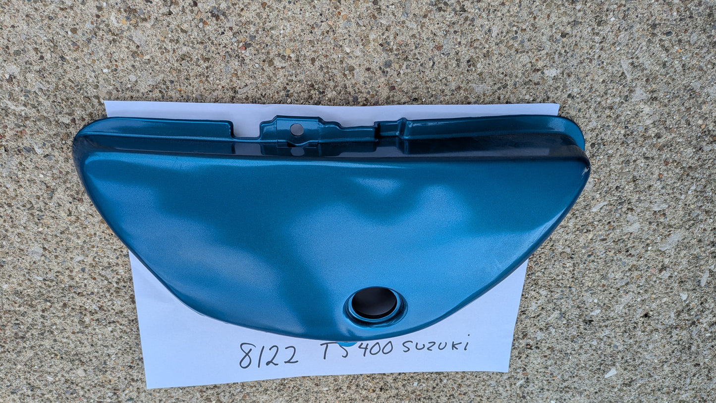 Suzuki TS400B NOS 1977 blue 47211-28601-279 sidecover my sku 8122