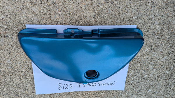 Suzuki TS400B NOS 1977 blue 47211-28601-279 sidecover my sku 8122