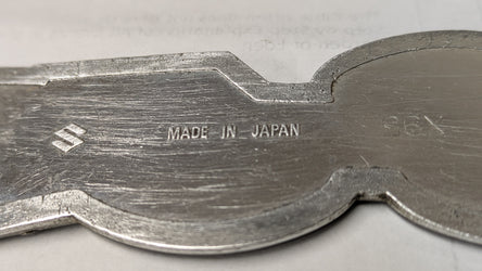 Suzuki TS185 sidecover badge OEM 1971 1972 part 68141-29000 sku 8340