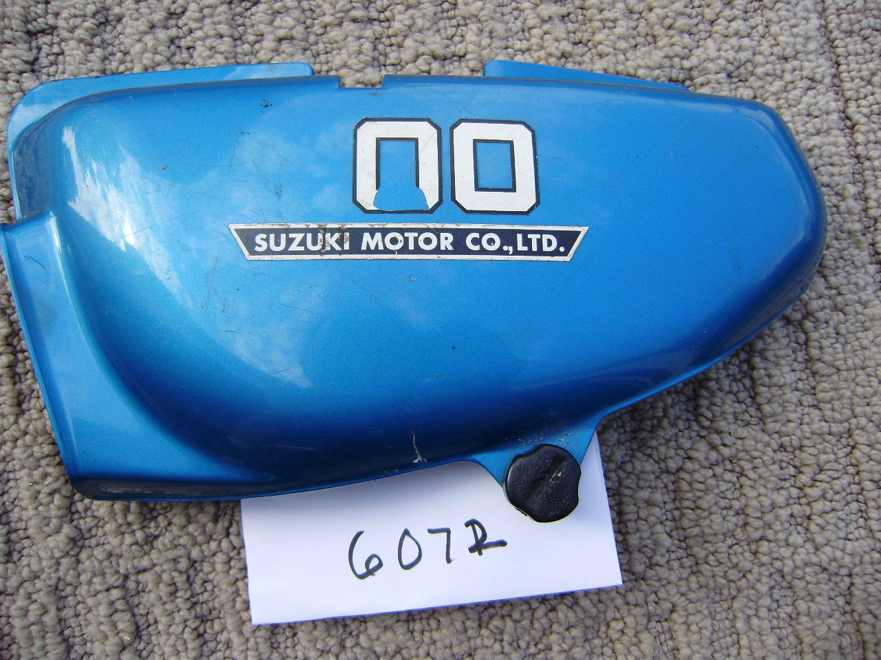 Suzuki TS100 side cover left blue 1976 Suzuki part number 47211-25610  my sku 6072