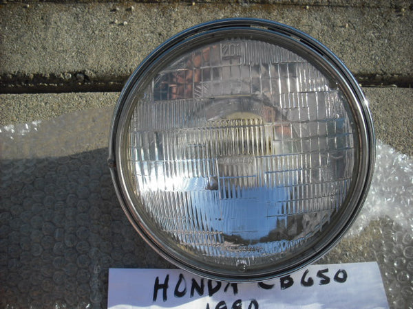SoldHonda 1980 CB650 33100-425-671 Working Headlight and Chrome Ring